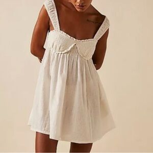 NWOT Blissful Breeze mini dress by Free People in size Large